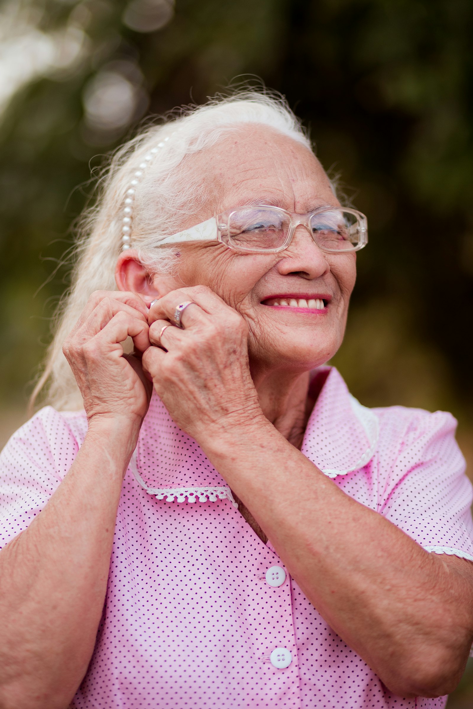 A patient in her seventies smiling after treatment