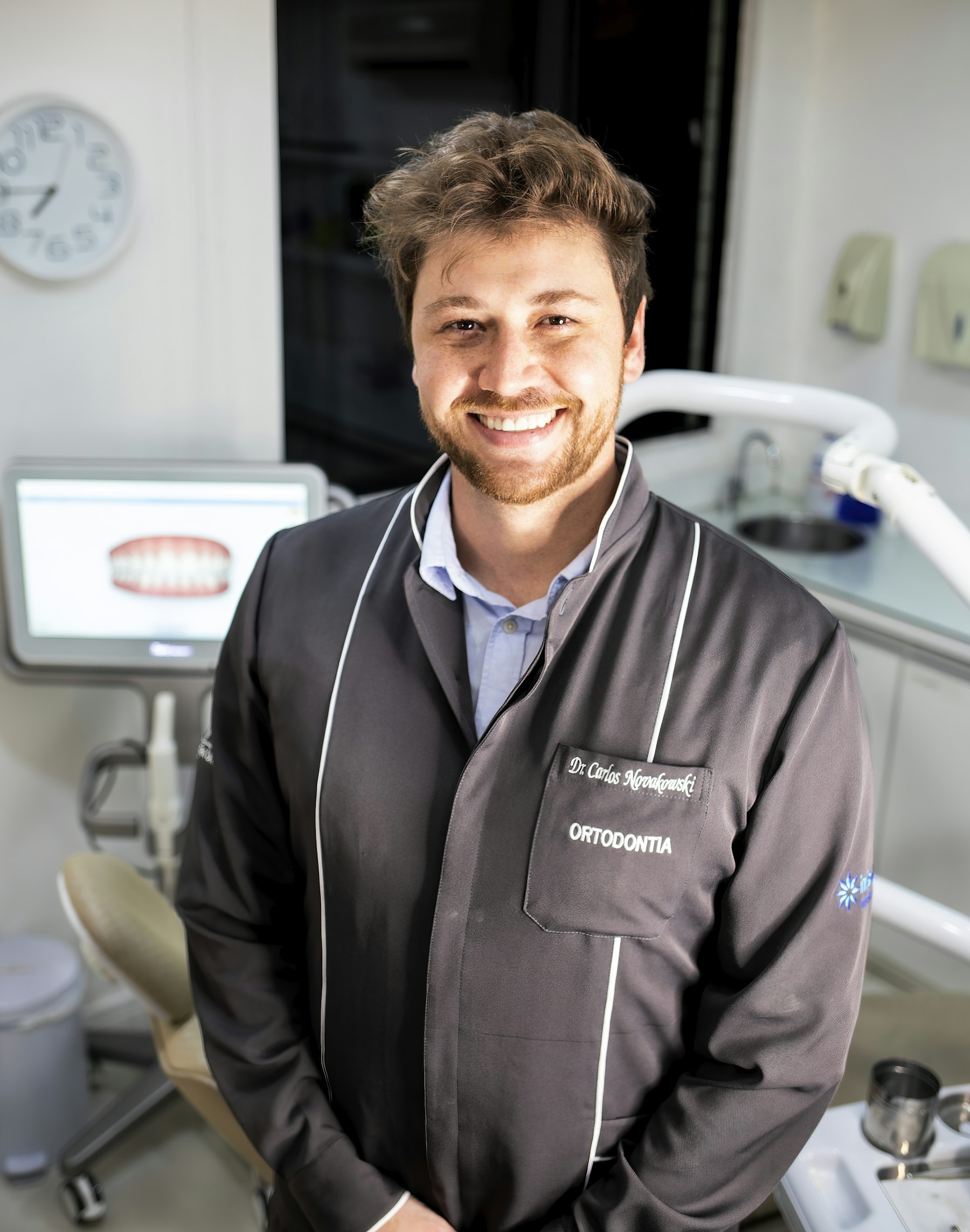 A man smiling after his visit